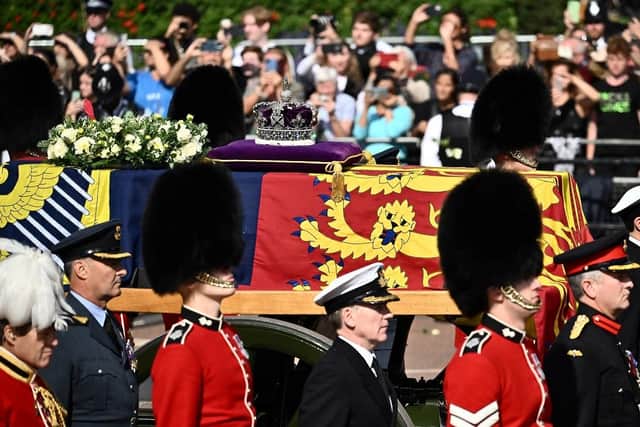 The coffin of Queen Elizabeth II during a procession from Buckingham Palace to the Palace of Westminster. (Pic credit: Marco Bertorello / AFP via Getty Images)