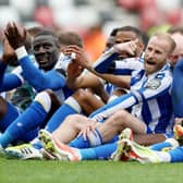 ELATION: Sheffield Wednesday players celebrate in front of the away fans at full-time with captain Barry Bannan at the centre of it all