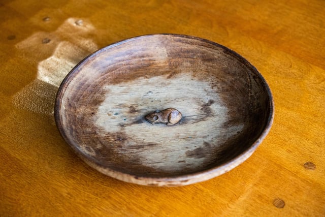 Pictured Lot:181 A Robert 'Mouseman' Thompson English oak fruit bowl with carved mouse to the interior 29cm d. Picture By Yorkshire Post Photographer,  James Hardisty. Date: 18th May 2023.