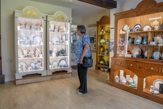 A visitor looks at the collection of Hornsea Pottery on display at Hornsea Museum, photographed for the Yorkshire Post Magazine by Tony Johnson. 23th May 2023