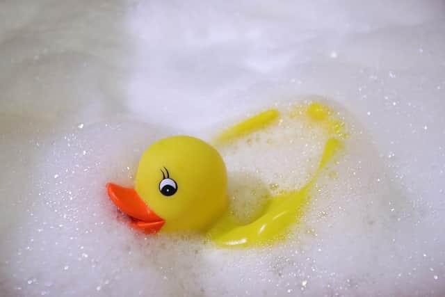 A rubber duck swims in a foam bath. (Pic credit: Alexander Hassenstein / Getty Images)