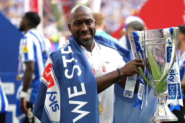 MISSION ACCOMPLISHED: Sheffield Wednesday manager Darren Moore celebrates with the League One Play-off Final trophy after leading his team to victory over Barnsley at Wembley Stadium  Picture: Nick Potts/PA