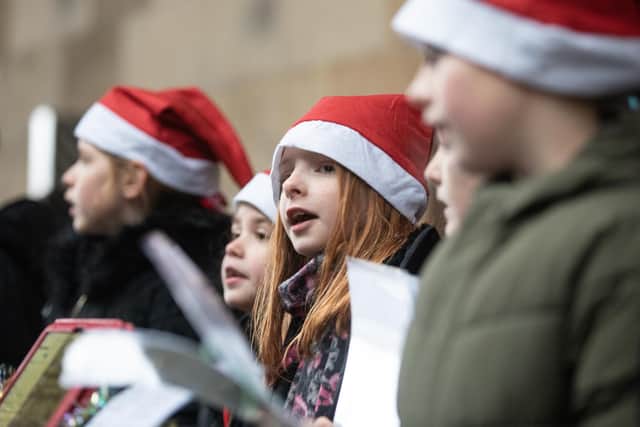 Children from Ryedale Primary Choir sing to passengers on the NYMR 'Santa Special' at Pickering station, an initiative of the Richard Shephard Music Foundation.