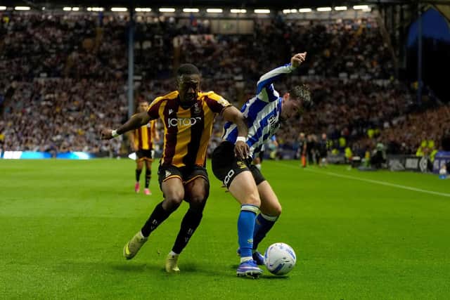 Sheffield Wednesday's Louie Barry (right) and Bradford City's Josh Neufville (left) battle for the ball during the Sky Bet League One match at Hillsborough Stadium, Sheffield. Picture date: Thursday August 20, 2026.