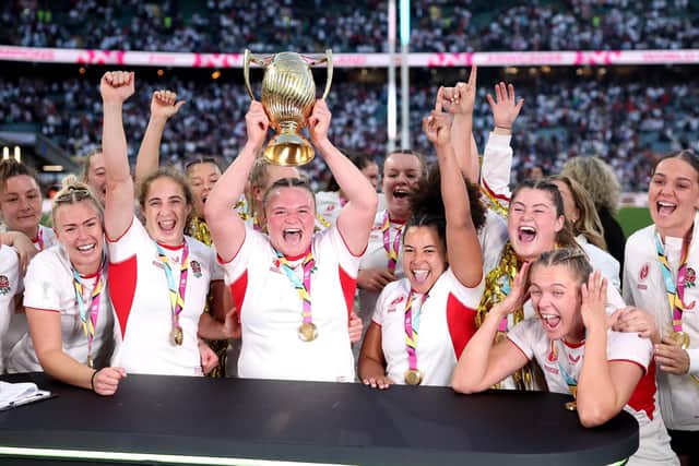 Tatyana Heard, front right, with Sarah Bern, Amy Cokayne, Rosie Galligan, Emma Sing, Abby Dow, Jess Breach, Alex Matthews, Morwenna Talling, Lark Atkins-Davies, TMaud Muir, Zoe Aldcroft, Maud Muir and Lilli Ives Campion of England celebrate with their winners medals following the Women's Rugby World Cup 2025 Final match between Canada and England at Allianz Stadium.