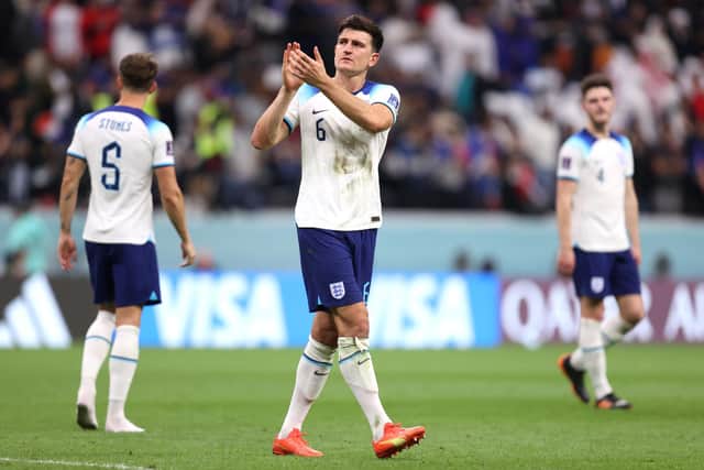 AL KHOR, QATAR - DECEMBER 10: Harry Maguire of England applauds fans after the 1-2 loss during the FIFA World Cup Qatar 2022 quarter final match between England and France at Al Bayt Stadium on December 10, 2022 in Al Khor, Qatar. (Photo by Julian Finney/Getty Images)