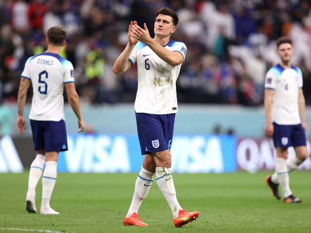 AL KHOR, QATAR - DECEMBER 10: Harry Maguire of England applauds fans after the 1-2 loss during the FIFA World Cup Qatar 2022 quarter final match between England and France at Al Bayt Stadium on December 10, 2022 in Al Khor, Qatar. (Photo by Julian Finney/Getty Images)