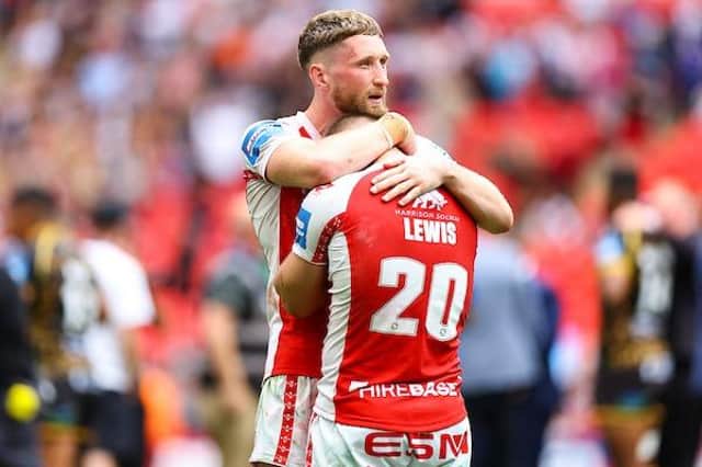Mikey Lewis is consoled by teammate Rowan Milnes after Hull KR's extra-time loss to Leigh Leopards in the Betfred Challenge Cup final. Picture by Will Palmer/SWpix.com.