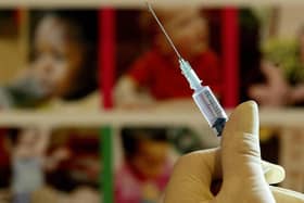 A nurse handling a syringe at a medical centre. PIC: Gareth Fuller/PA Wire