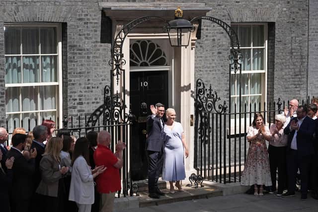 New Prime Minister Andy Burnham waves with his wife Marie-France van Heel, after his speech in Downing Street, London, after meeting King Charles III and accepting his invitation to become Prime Minister and form a new government. Gareth Fuller/PA Wire