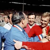 Sir Alf Ramsey, Bobby Moore and Nobby Stiles with the World Cup 1966 trophy. Picture: PA/Ron Bell/PA Wire.