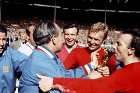 Sir Alf Ramsey, Bobby Moore and Nobby Stiles with the World Cup 1966 trophy. Picture: PA/Ron Bell/PA Wire.