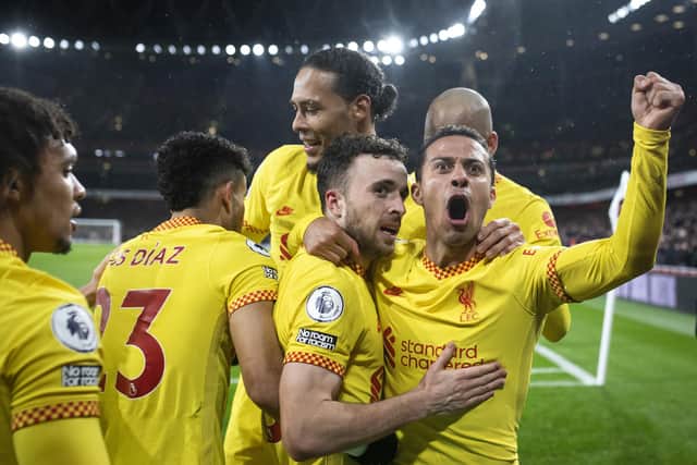 Diogo Jota of Liverpool celebrates scoring for Liverpool with team mate Thiago Alcantara during the Premier League match between Arsenal and Liverpool at Emirates Stadium on March 16, 2022 in London, England. (Photo by Justin Setterfield/Getty Images)