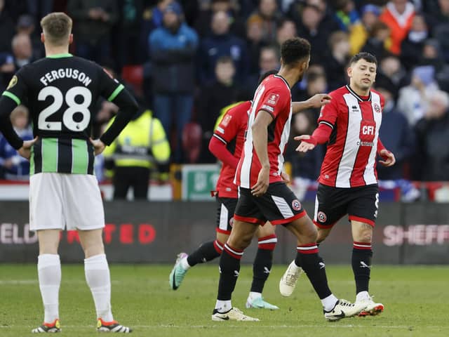 Sheffield United's Gustavo Hamer (right) celebrates scoring their side's first goal of the game during the Emirates FA Cup fourth round tie against Brighton at Bramall Lane. Picture: Richard Sellers/PA Wire.