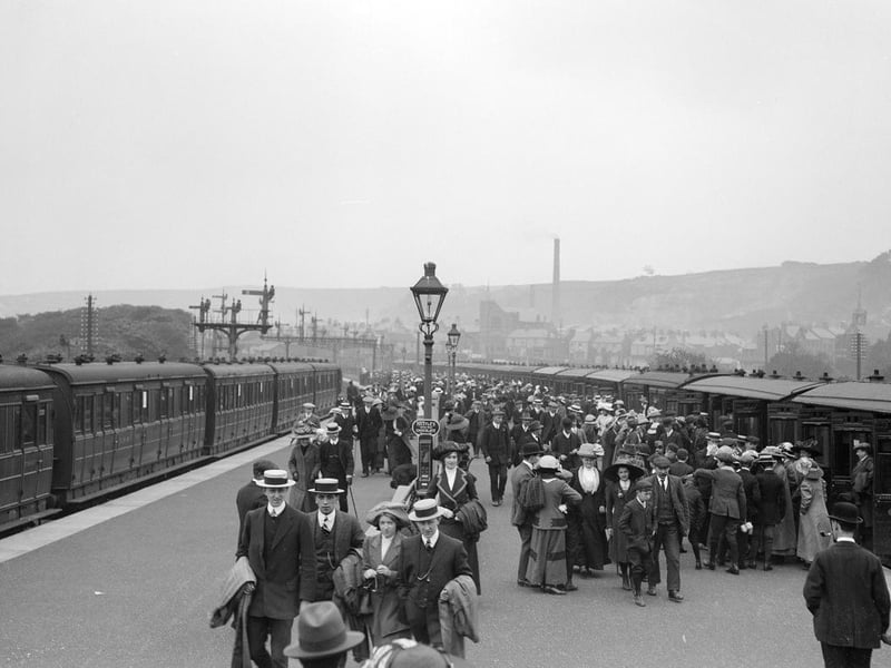 Crowds of day-trippers and holidaymakers arriving on a platform at Scarborough railway station in 1913.