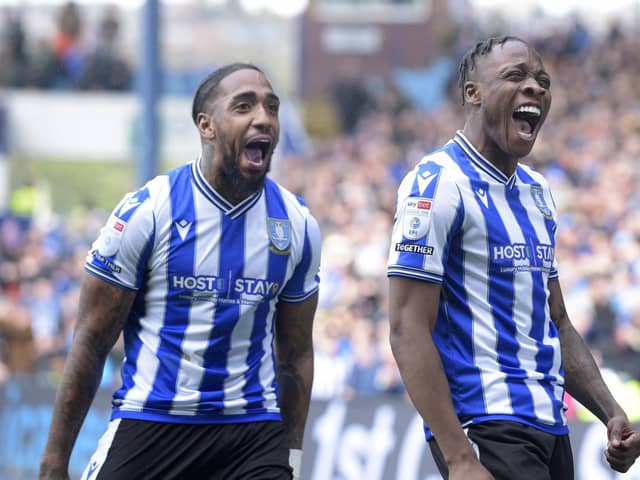 Dennis Adeniran celebrates his first half goal with Mallik Wilks as Sheffield Wednesday went back on top of League One with a 3-0 win over Accrington (Picture: Steve Ellis)