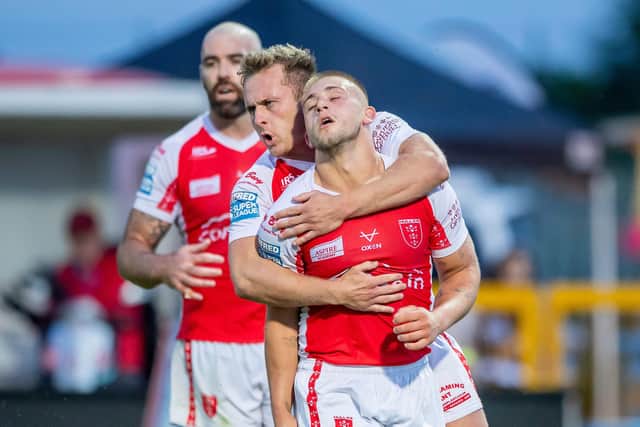 Hull KR's Mikey Lewis is congratulated on scoring a try against Wakfield by Jez LItten. (Picture: SWPix.com)