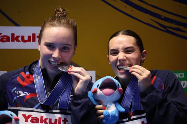 Silver medalists Yasmin Harper, left, and Scarlett Mew Jensen of Team Great Britain pose during the medal ceremony for the Women's Synchronized 3m Springboard Final on day four of the Fukuoka 2023 World Aquatics Championships (Picture: Adam Pretty/Getty Images)