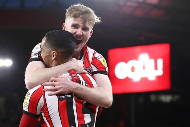 FRINGE PERFORMERS: Tommy Doyle celebrates with Max Lowe after making Sheffield United's third goal