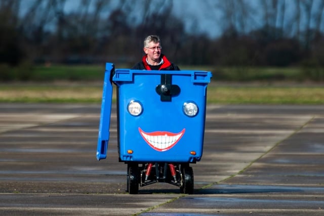 Kevin Nicks, of Chipping Norton, Oxfordshire, driving his latest vehicle at Elvington Airfield, a commercial dustbin which is fully allowed to be driven on the road.