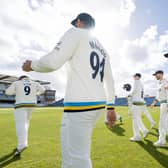 Shan Masood leads Yorkshire on to the field as the sun finally breaks on the new cricket season. Picture by Allan McKenzie/SWpix.com