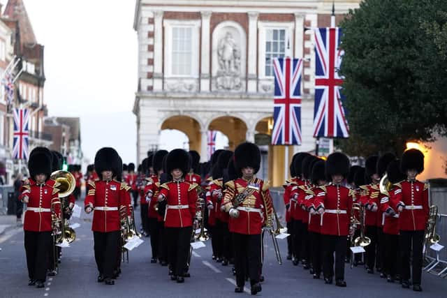 Members of the Band of the Grenadier Guards march down the High Street in Windsor following an early morning rehearsal for the funeral of Queen Elizabeth II, ahead of her funeral on Monday. Picture date: Saturday September 17, 2022. PA Photo. See PA story DEATH Queen. Photo credit should read: Andrew Matthews/PA Wire
