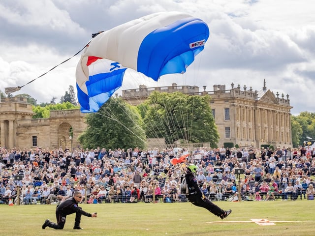 Chatsworth Country Fair 2025 - Sara Orton from Bridlington and part of the Parachute Display Team supporting Royal British Legion lands in the grand arena during the opening ceremony on Saturday. Picture Marisa Cashill 30-8-25