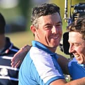 Europe's English golfer, Matt Fitzpatrick (R) and Europe's Northern Irish golfer, Rory McIlroy (L) celebrate their four-ball match win on the first day of play in the 44th Ryder Cup at the Marco Simone Golf and Country Club in Rome (Picture: ALBERTO PIZZOLI/AFP via Getty Images)