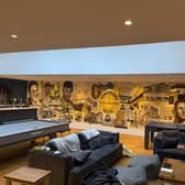 Chris Ashmore, 39, who taught himself mural painting a decade ago, spent two and a half months transforming a wall inside a home into a homage to Sheffield.