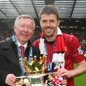 MANCHESTER, ENGLAND - MAY 12:  Manager Sir Alex Ferguson and Michael Carrick of Manchester United celebrate with the Premier League trophy after the Barclays Premier League match between Manchester United and Swansea City at Old Trafford on May 12, 2013 in Manchester, England.  (Photo by Matthew Peters/Manchester United via Getty Images)