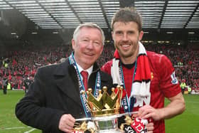 MANCHESTER, ENGLAND - MAY 12:  Manager Sir Alex Ferguson and Michael Carrick of Manchester United celebrate with the Premier League trophy after the Barclays Premier League match between Manchester United and Swansea City at Old Trafford on May 12, 2013 in Manchester, England.  (Photo by Matthew Peters/Manchester United via Getty Images)