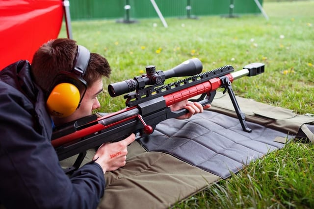 Visitors queued up to have a go at shooting the 50 cal rifle.