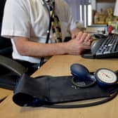 A GP at their desk. PIC: Anthony Devlin/PA Wire