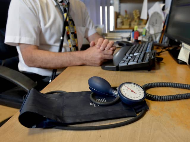 A GP at their desk. PIC: Anthony Devlin/PA Wire
