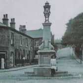 The original fountain when it was in place at Bailiff Bridge crossroads, pictured circa 1912