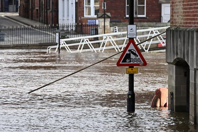 A road sign in a street flooded by the River Ouse after it burst its banks, in central York.
