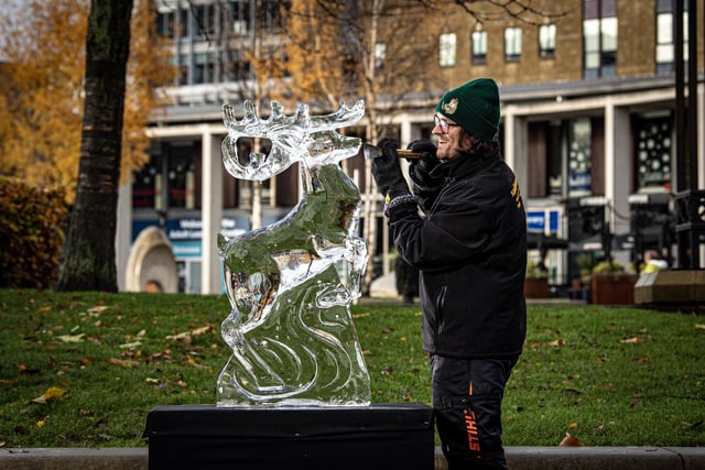 Sculptor Dave Martin from Sand In Your Eye with his ice reindeer