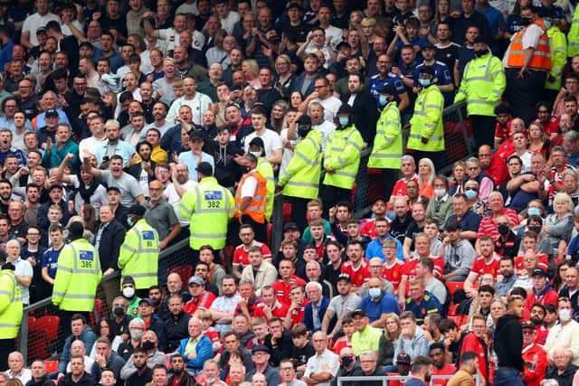 HOSTILITY: Stewards separate Leeds United and Manchester United fans at last season's Premier League game at Old Trafford
