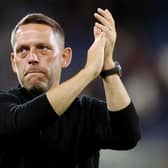 HUDDERSFIELD, ENGLAND - SEPTEMBER 13: Leam Richardson, Manager of Wigan Athletic applauds fans prior to the Sky Bet Championship between Huddersfield Town and Wigan Athletic at John Smith's Stadium on September 13, 2022 in Huddersfield, England. (Photo by Charlotte Tattersall/Getty Images)