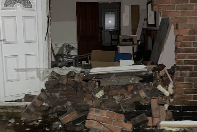 Pictures show the damage after the cars were removed after crashing through the front of a house. Submitted picture