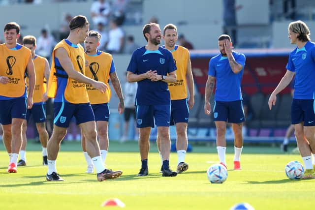 STICKING TOGETHER: England manager Gareth Southgate pictured with his players during a training session at the Al Wakrah Sports Complex during the Qatar World Cup last year. Picture: Martin Rickett/PA