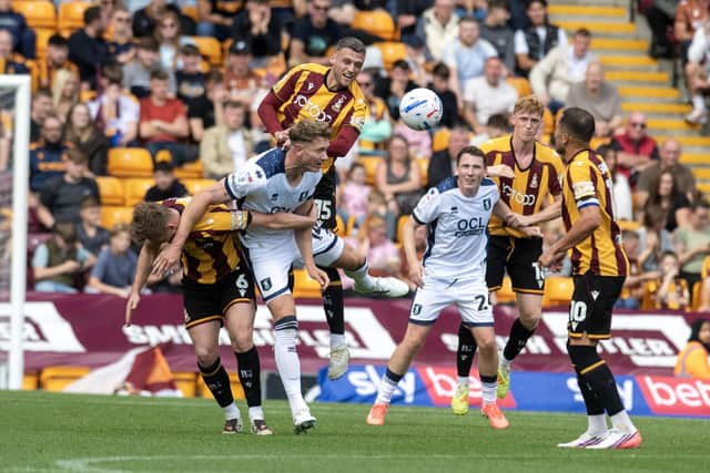 MEAN MACHINE: Aden Baldwin (top) is a key part of the Football League's meanest defence this season (Image: Tony Johnson)
