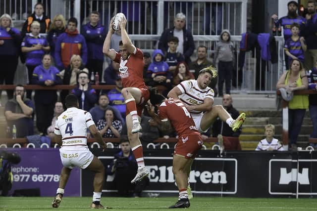 Joe Burgess leaps highest to catch a kick. (Photo: Matthew Merrick/SWpix.com)