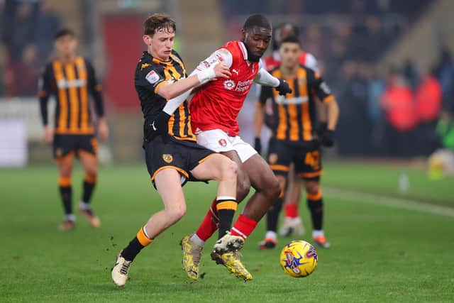 TUSSLE: Hull City's Tyler Morton competes with Christ Tiehi of Rotherham United for the ball