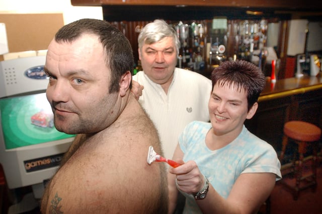 The Goldmine Bar and Grill barmaid Tracey Robson was pictured with owner Danny Graham (centre) and his son Karl who were taking part in a sponsored back wax. But who can remember which year this was?