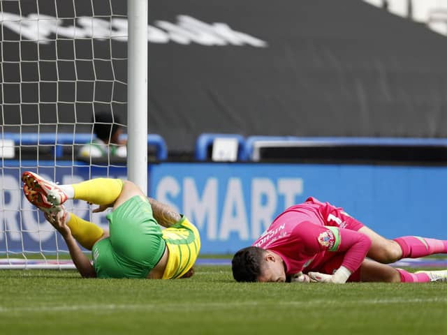 BAD DAY: Huddersfield Town goalkeeper Lee Nicholls, prone as Norwich City's Josh Sargent opens the scoring