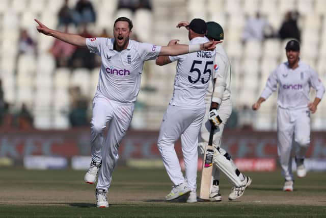 Ollie Robinson, the former Yorkshire pace bowler, peels away in celebration after taking the wicket that sealed England's 26-run win against Pakistan in Multan. Photo by Matthew Lewis/Getty Images.
