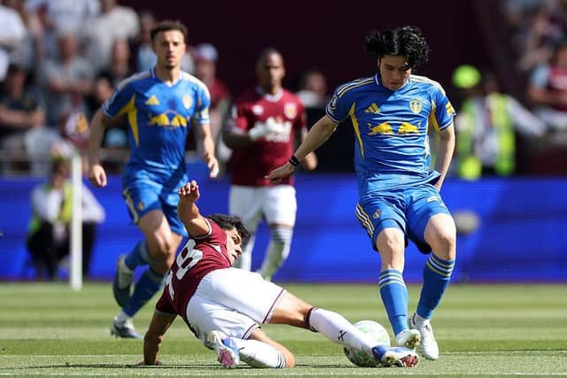 GETTING STUCK IN: Ao Tanaka of Leeds United is challenged by Mateus Fernandes (Image: Richard Pelham/Getty Images)