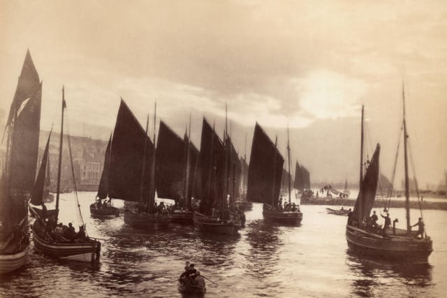 circa 1880:  Small fishing boats about to set sail from Whitby harbour.  (Photo by Frank Meadow Sutcliffe/Getty Images)