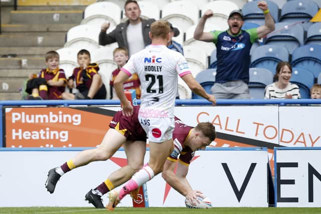 Sam Halsall goes over in the corner to score Huddersfield's opening try. (Photo: Ed Sykes/SWpix.com)
